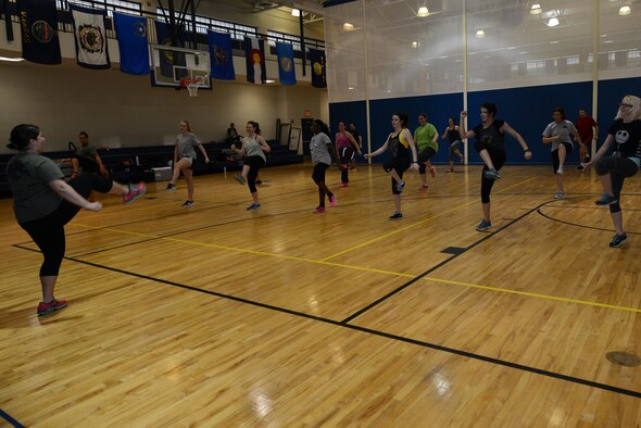 Kathryn Bailey, Zumba instructor, leads the Zombie Zumba event March 13, 2015, at Moody Air Force Base, Ga. Zumba combines all elements of fitness including cardio, flexibility and muscle conditioning into a dance fitness class. (U.S. Air Force photo by Airman 1st Class Kathleen D. Bryant/Released) 