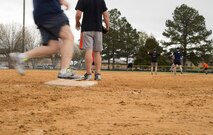 A members of the Chiefs team rounds the bases as members of the Eagles team recover the ball during the annual Eagles versus Chiefs softball game March 13, 2015, at Moody Air Force Base, Ga. The Chiefs attempted to mount a comeback scoring eight points in the third inning. (U.S. Air Force photo by Staff Sgt. Eric Summers Jr./Released)