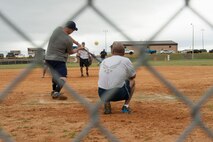 U.S. Air Force Col. Michael Ross, 820th Base Defense Group commander, swings at an oncoming softball during the annual Eagles versus Chiefs softball game March 13, 2015, at Moody Air Force Base, Ga. The Eagles dominated the Chiefs winning 29-12. (U.S. Air Force photo by Staff Sgt. Eric Summers Jr./Released)