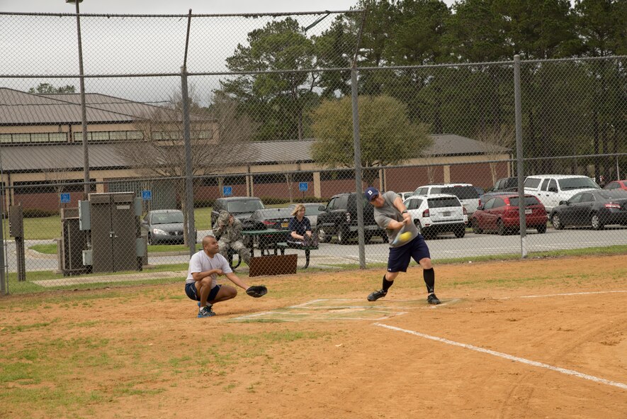 U.S. Air Force Col. Michael Ross, 820th Base Defense Group commander, makes contact with a softball during the Eagles versus Chiefs softball game March 13, 2015, at Moody Air Force Base, Ga. The Eagles took an early 12-point lead in the first inning. (U.S. Air Force photo by Staff Sgt. Eric Summers Jr./Released)