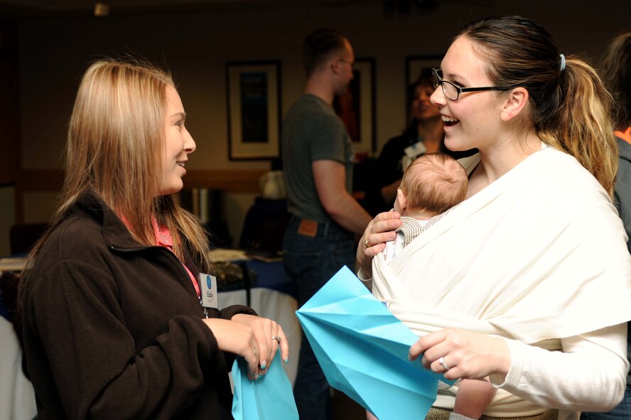 Ellsworth military spouses participate in an airplane icebreaker activity during the first quarter Heartlink workshop at the Airman and Family Readiness Center at Ellsworth Air Force Base, S.D., March 6, 2015. Heartlink provides an opportunity for spouses of active duty military members to learn about the Air Force, its structure and the 28th Bomb Wing mission, and to network with newcomers to the base. (U.S. Air Force photo by Senior Airman Hailey R. Staker/Released) 