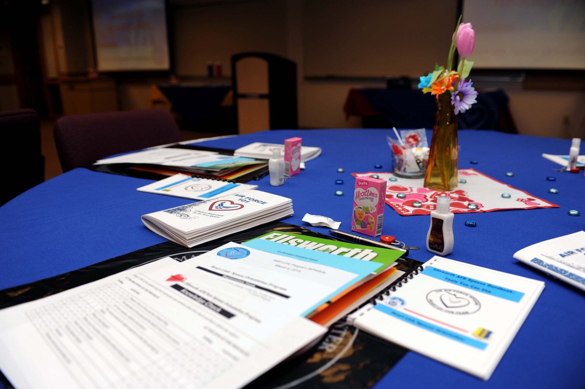 A display of resources available to military spouses is laid out prior to the start of the first quarter Heartlink workshop at the Airman and Family Readiness Center at Ellsworth Air Force Base, S.D., March 6, 2015. Among the pamphlets and handouts is the Ellsworth spouse’s handbook, which includes family support and resource agency contact information, employment resources, resume writing workshop information and a schedule for upcoming financial readiness classes. (U.S. Air Force photo by Senior Airman Hailey R. Staker/Released)