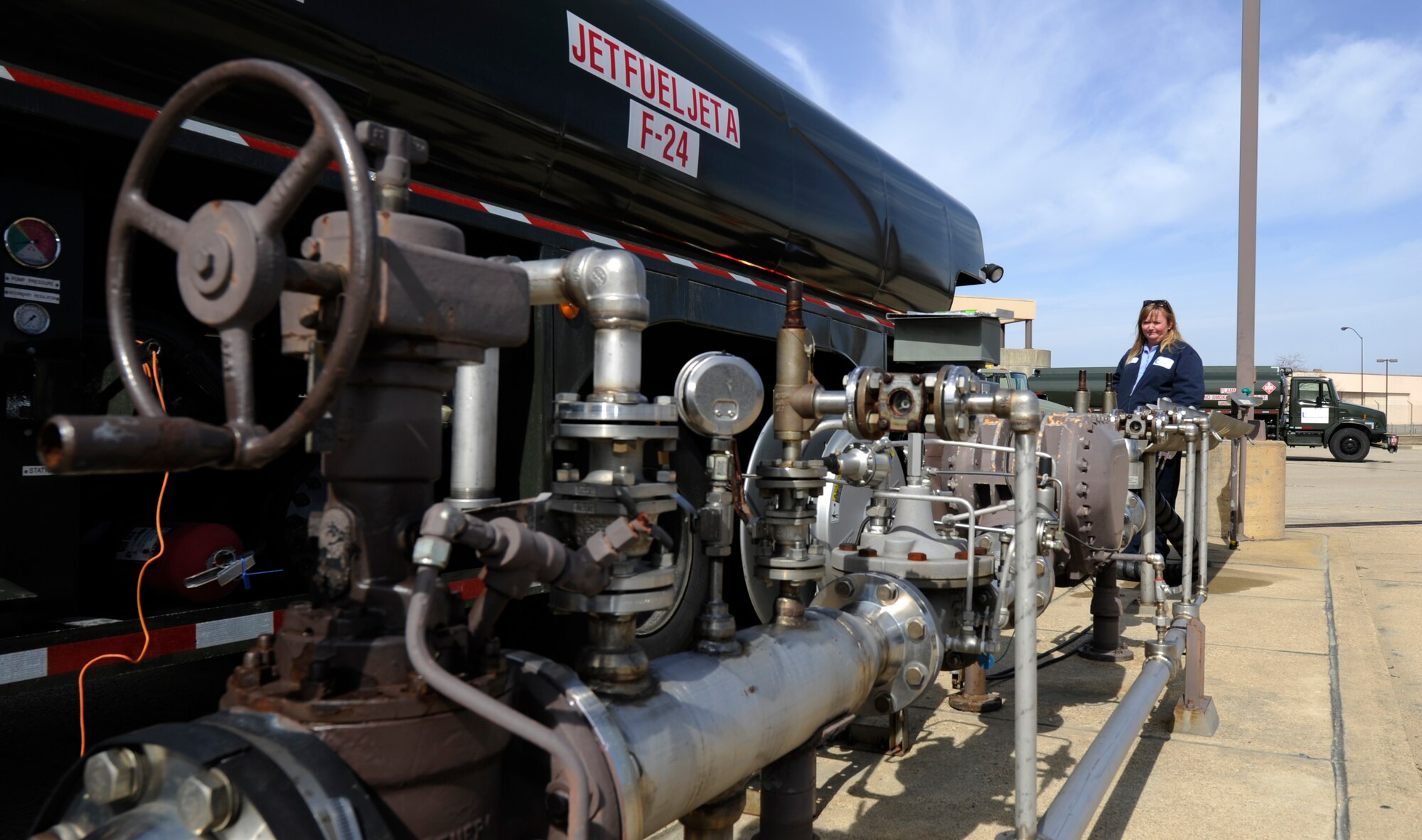 Kristen Huffman, Akima Technological Solutions fuels distribution system operator, utilizes the refueling hydrant at Joint Base Andrews, Maryland, March 16, 2015. The secured fuel must be filtered three times prior to powering the aircraft. (U.S. Air Force photo/Senior Airman Nesha Humes)