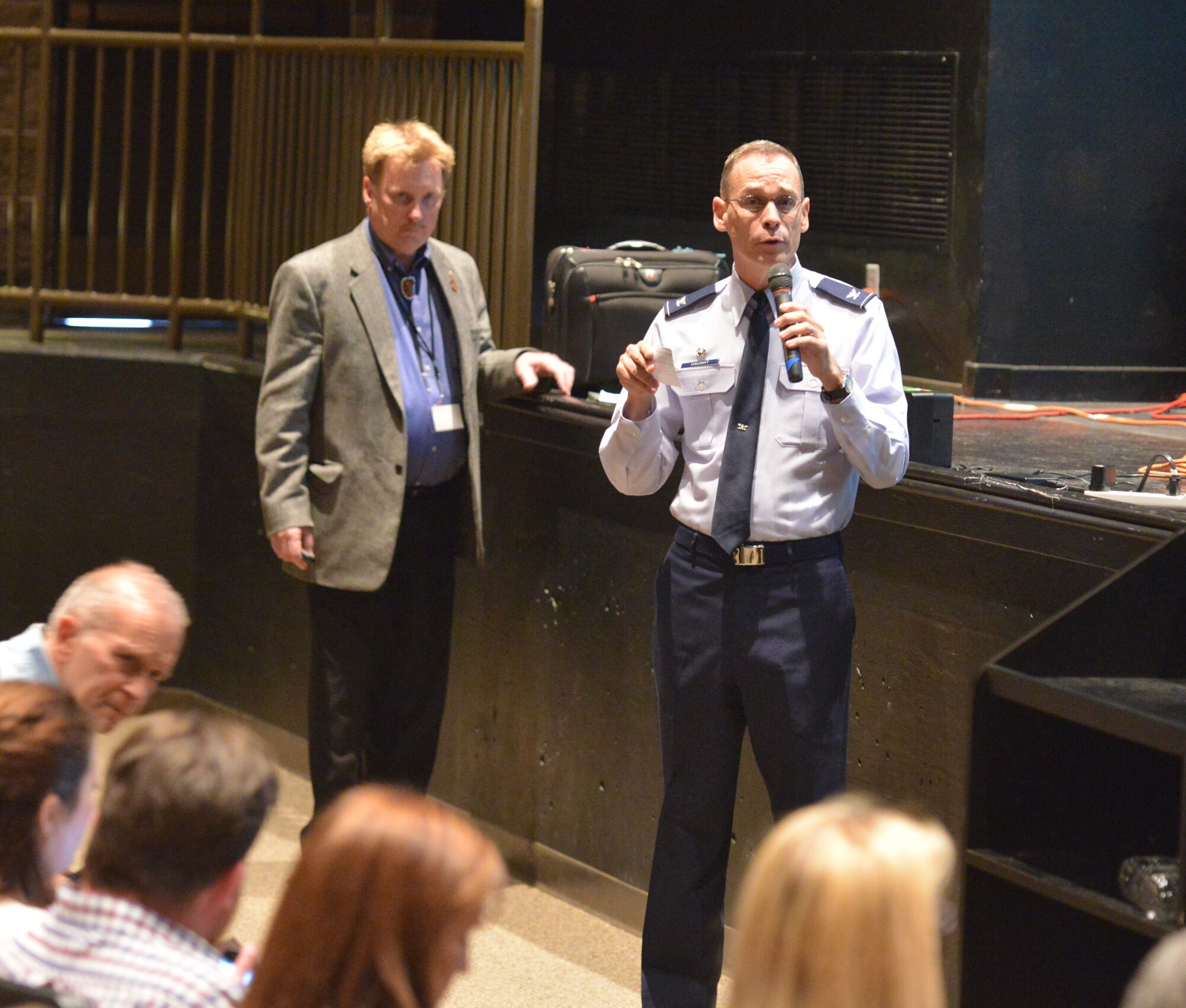 377th Mission Support Squadron Commander Col. Dennis Haught (Left) and Dennis McQuillian, NMED geologist, detail cleanup plans and efforts before a public meeting March 11 in Albuquerque. (Photo by Todd Berenger) 