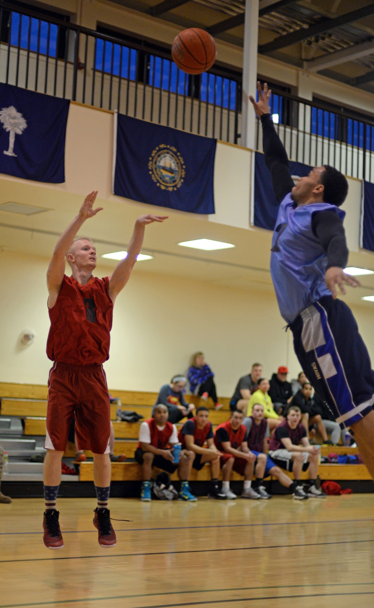 U.S. Air Force Airman 1st Class Wesley Tefft, left, 100th Logistics Readiness Squadron vehicle maintenance mechanic from Scottsdale, Ariz., goes man-to-man with U.S. Air Force Staff Sgt. Rodney Martin, 100th Civil Engineer Squadron water and fuels systems maintenance craftsman, March 12, 2015, during a basketball championship game held at the Hardstand Fitness Center on RAF Mildenhall, England. The 100th CES was champion to the 100th LRS with a final score of 67-53. (U.S. Air Force photo by Senior Airman Christine Griffiths/Released)