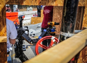 Teams from around the world put their robots to the test March 12, 2015, at Joint Base Charleston, S.C. during The Defense Advanced Research Projects Agency (DARPA) robotics systems competition. The event was hosted by Space and Naval Warfare Systems Center Atlantic (SPAWAR). The robots are being developed to respond to human and man-made disasters.  The finals are scheduled to take place in California, June 2015. (U.S. Air Force Photo / Senior Airman Tom Brading) 
