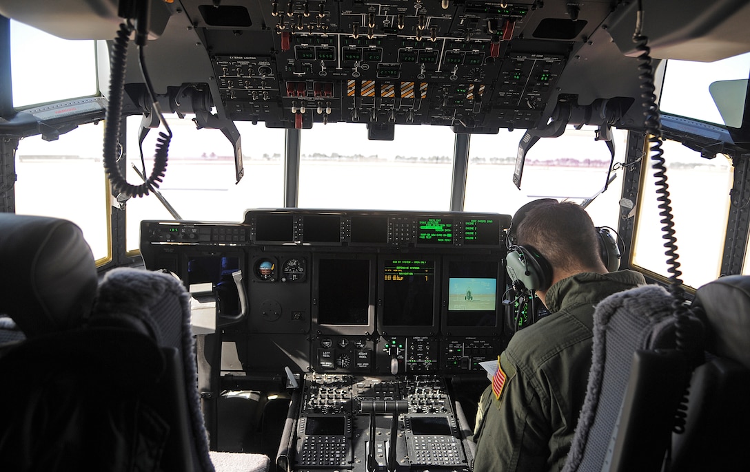 A loadmaster from the 17th Special Operation Squadron completes a checklist for a MC-130J Commando II before takeoff from Kunsan Air Base, Republic of Korea, March, 2, 2015. During Exercise Gryphon Knife, Airmen stationed out of Kadena Air Base, Japan, came to the ROK to support the objectives and learn the mission of Special Operations Command Korea.  (U.S. Air Force photo by Senior Airman Divine Cox/Released)