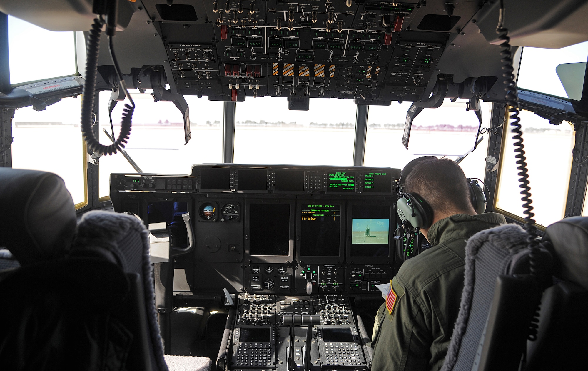 A loadmaster from the 17th Special Operation Squadron completes a checklist for a MC-130J Commando II before takeoff from Kunsan Air Base, Republic of Korea, March, 2, 2015. During Exercise Gryphon Knife, Airmen stationed out of Kadena Air Base, Japan, came to the ROK to support the objectives and learn the mission of Special Operations Command Korea.  (U.S. Air Force photo by Senior Airman Divine Cox/Released)