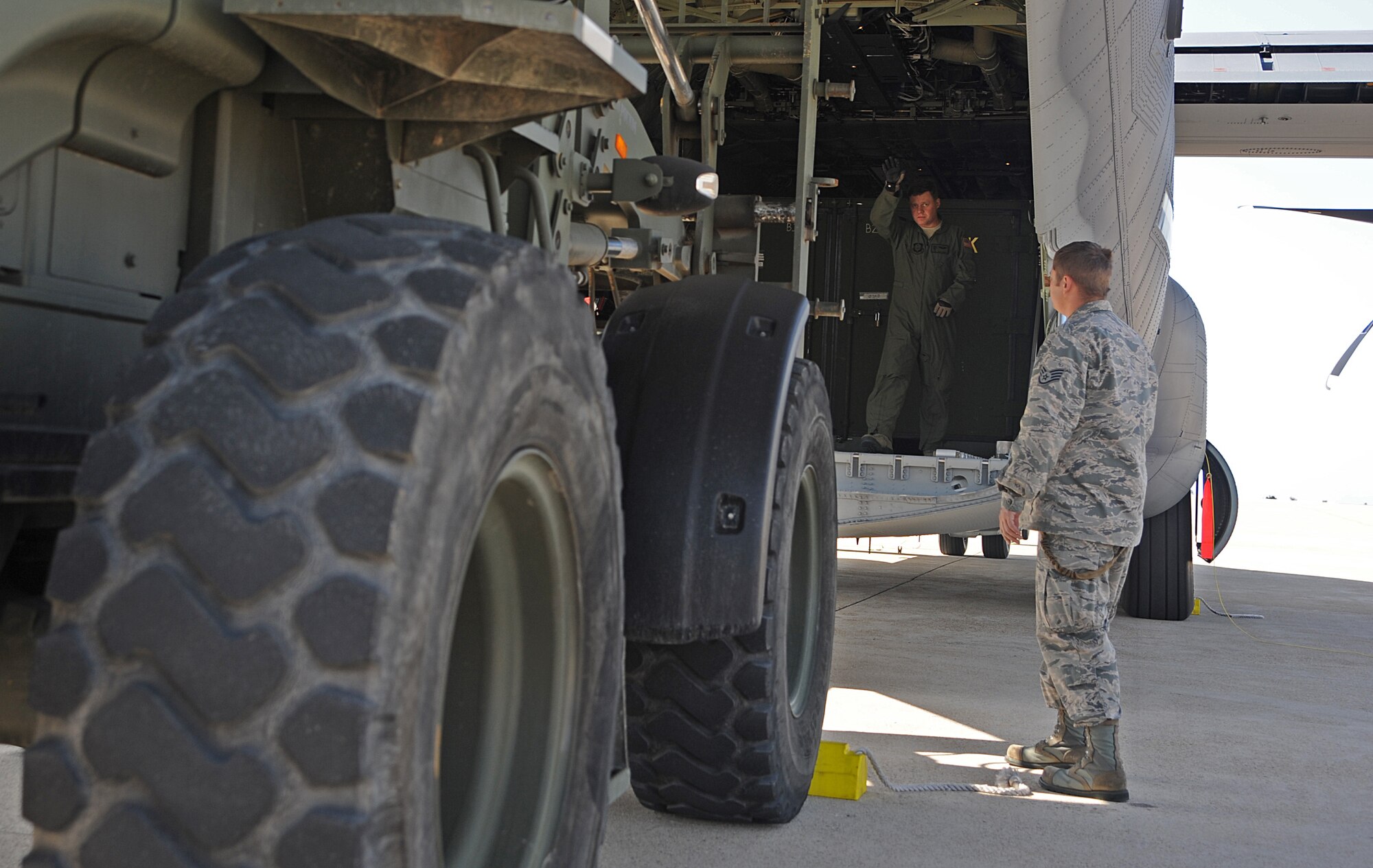 A loadmaster from the 17th Special Operation Squadron loads cargo onto a MC-130J Commando II at Kunsan Air Base, Republic of Korea, March, 2, 2015. During Exercise Gryphon Knife, Airmen stationed out of Kadena Air Base, Japan, came to the ROK to support the objectives and learn the mission of Special Operations Command Korea.  (U.S. Air Force photo by Senior Airman Divine Cox/Released)