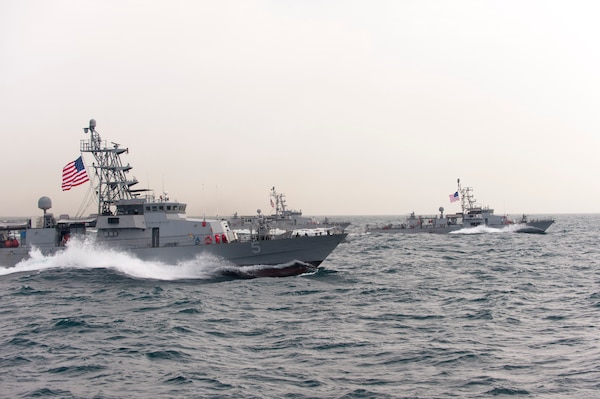 U.S. 5TH FLEET AREA OF RESPONSIBILITYS (March 17, 2014) The Cyclone-class coastal patrol ship USS Typhoon (PC 5) and other coastal patrol ships assigned to Patrol Coastal Squadron 1 (PCRON 1) transit in formation during a divisional tactics exercise. PCRON 1 is deployed to the U.S. 5th Fleet area of responsibility supporting maritime security operations and theater security cooperation efforts. (U.S. Navy photo by Mass Communication Specialist 2nd Class Charles Oki/Released)