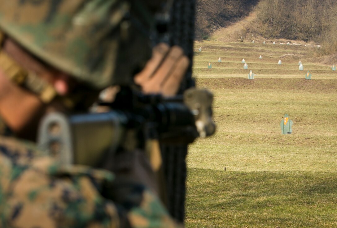A U.S. Marine with Special-Purpose Marine Air-Ground Task Force Crisis Response-Africa aims at a target during joint training with Army Special Forces in Baumholder, Germany, March 9, 2015. The Marines rapidly engaged targets at unknown distances alongside Special Forces personnel during a series of live-fire drills. (U.S. Marine Corps photo by Sgt. Paul Peterson/Released)