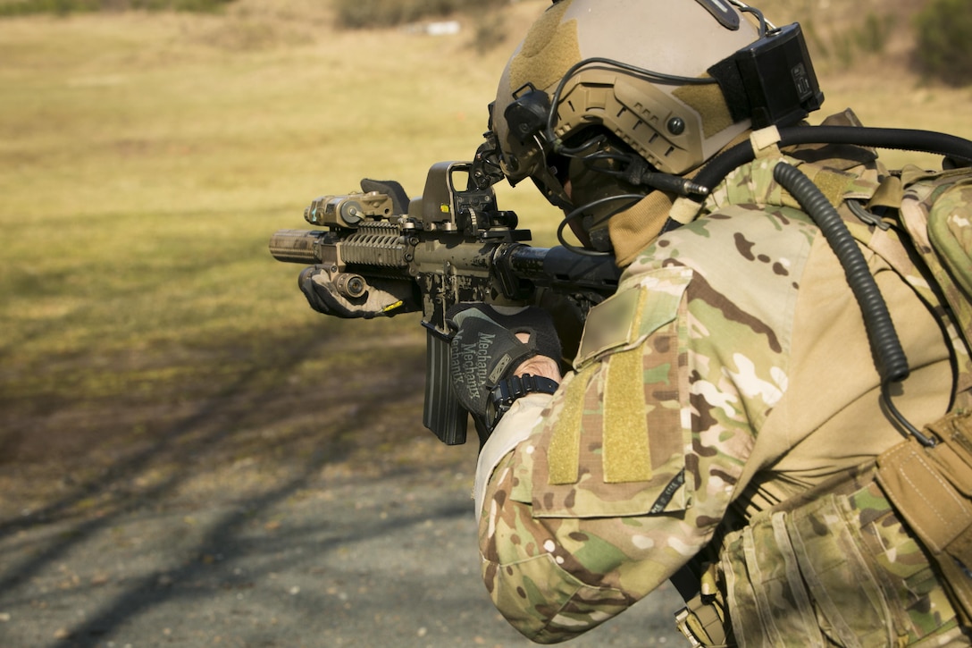 A U.S. Army Special Forces member engages targets during a joint training exercise with Marines from Special-Purpose Marine Air-Ground Task Force Crisis Response-Africa in Baumholder, Germany, March 9, 2015. The two groups spent more than a week honing their ability to operate together for future operations. (U.S. Marine Corps photo illustration by Sgt. Paul Peterson/Released)