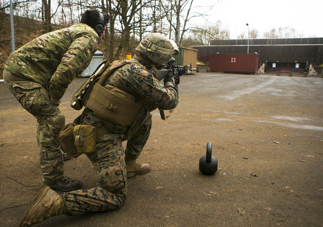 A U.S. Marine with Special-Purpose Marine Air-Ground Task Force Crisis Response-Africa engages targets during a combat efficiency test in Baumholder, Germany, March 10, 2015. U.S. Army Special Forces personnel created a series of mentally and physically challenging tasks designed to test the Marines’ abilities to complete combat operations in an urban environment. (U.S. Marine Corps photo by Sgt. Paul Peterson/Released)