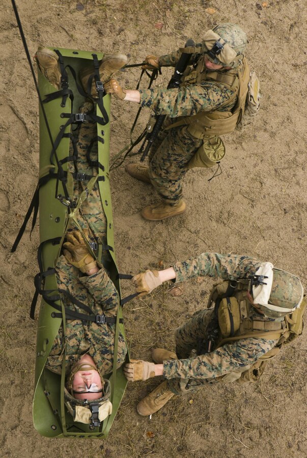 U.S. Marines with Special-Purpose Marine Air-Ground Task Force Crisis Response-Africa lower a simulated casualty during a combat efficiency test in Baumholder, Germany, March 10, 2015. U.S. The Marines used repelling techniques taught by U.S. Army Special Forces to remove the casualty from the roof of a building during a simulated raid. (U.S. Marine Corps photo by Sgt. Paul Peterson/Released)