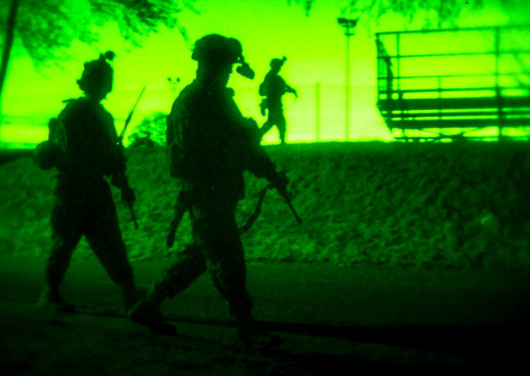 U.S. Marines with Special-Purpose Marine Air-Ground Task Force Crisis Response-Africa maneuver down a street during a joint raid with Army Special Forces in Baumholder, Germany, March 11, 2015. The two groups spent more than a week training together to develop their ability to conduct missions in Africa. (U.S. Marine Corps photo by Sgt. Paul Peterson/Released)