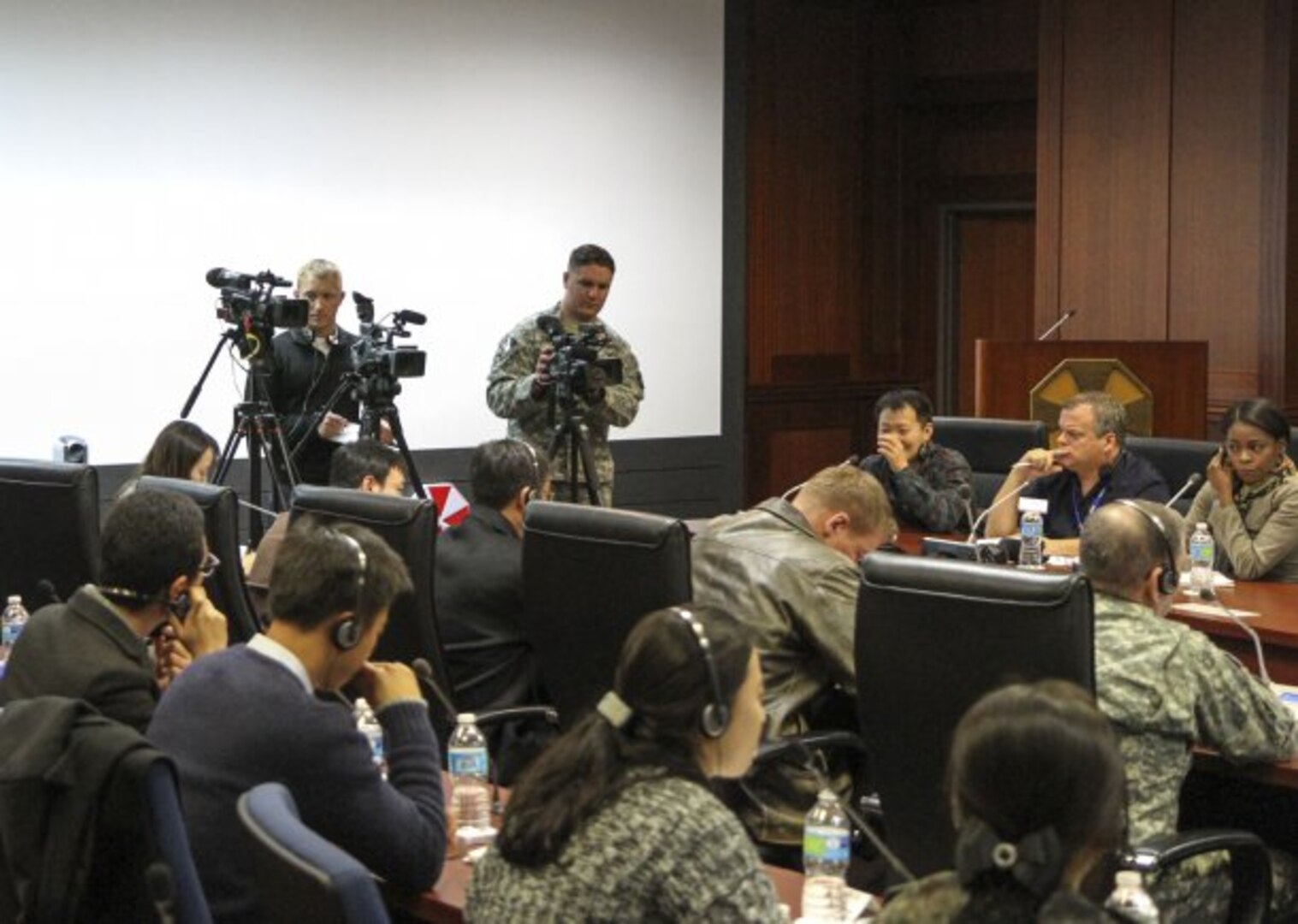 Staff Sgt. David Strayer (top, center with video camera), a public affairs specialist with the 109th Mobile Public Affairs Detachment, 213th Regional Support Group, records footage of a mock press conference Mar. 11, 2015, on Yongsan Garrison, South Korea. Strayer supported the 109th MPAD's mission as a Pennsylvania Army National Guard augmentee during the 2015 Key Resolve exercise.