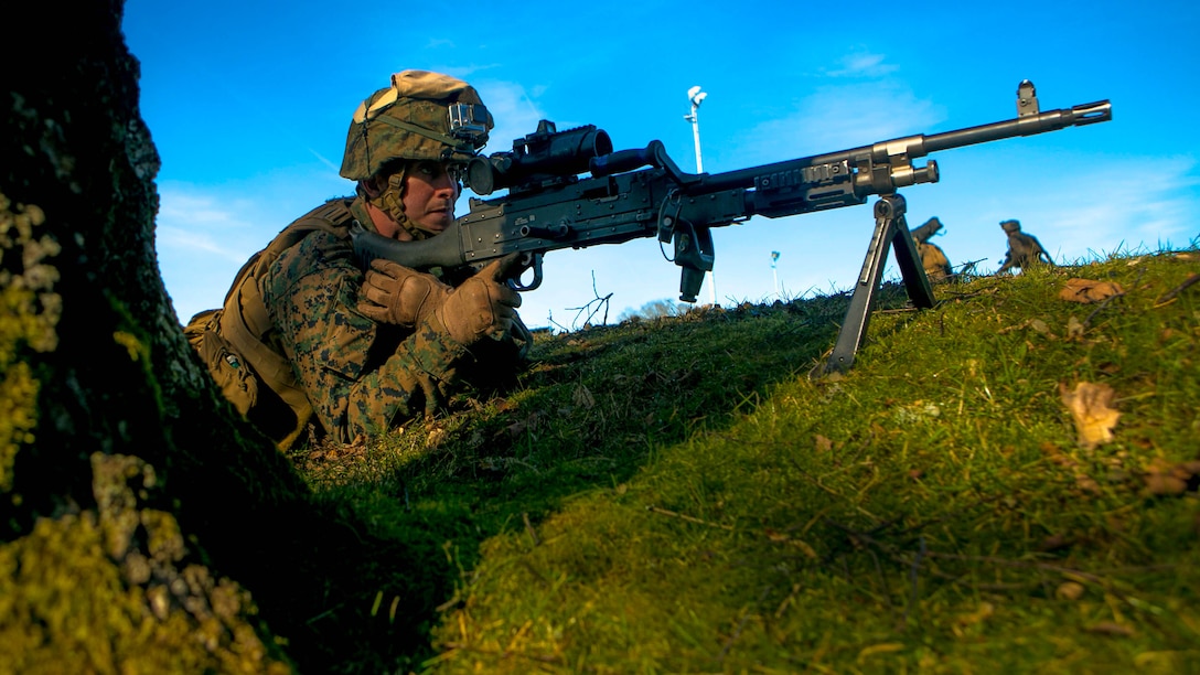 A Marine with Special-Purpose Marine Air-Ground Task Force Crisis Response-Africa, provides security during a mock assault with U.S. Army Special Forces in Baumholder, Germany, March 11, 2015.  The Marines established a cordon around a block of buildings, clearing the way for a precision assault by Special Forces personnel. 