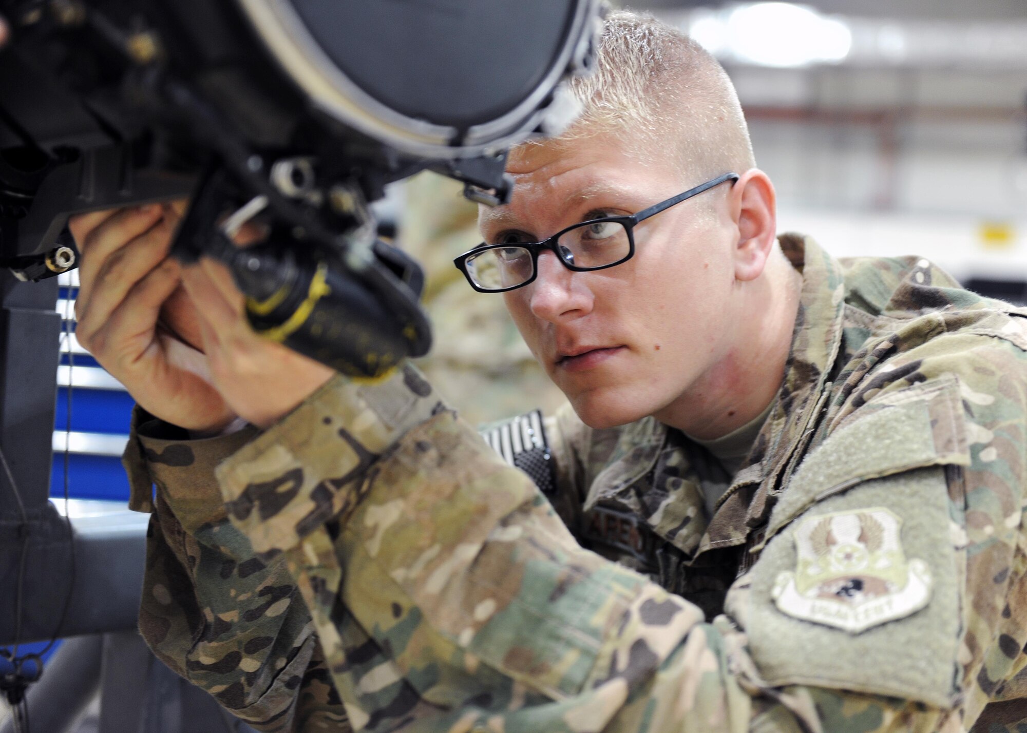 U.S. Air Force Staff Sgt. Damion Arendtsen, 455th Expeditionary Maintenance Squadron Armament technician, performs an electrical and maintenance check on an F-16 Fighting Falcon gun system March 12, 2015 at Bagram Airfield, Afghanistan. Airmen assigned to the Armament shop are charged with the responsibility of ensuring weapons systems are standing by to support counterterrorism operations in Afghanistan. (U.S. Air Force photo by Staff Sgt. Whitney Amstutz/released)