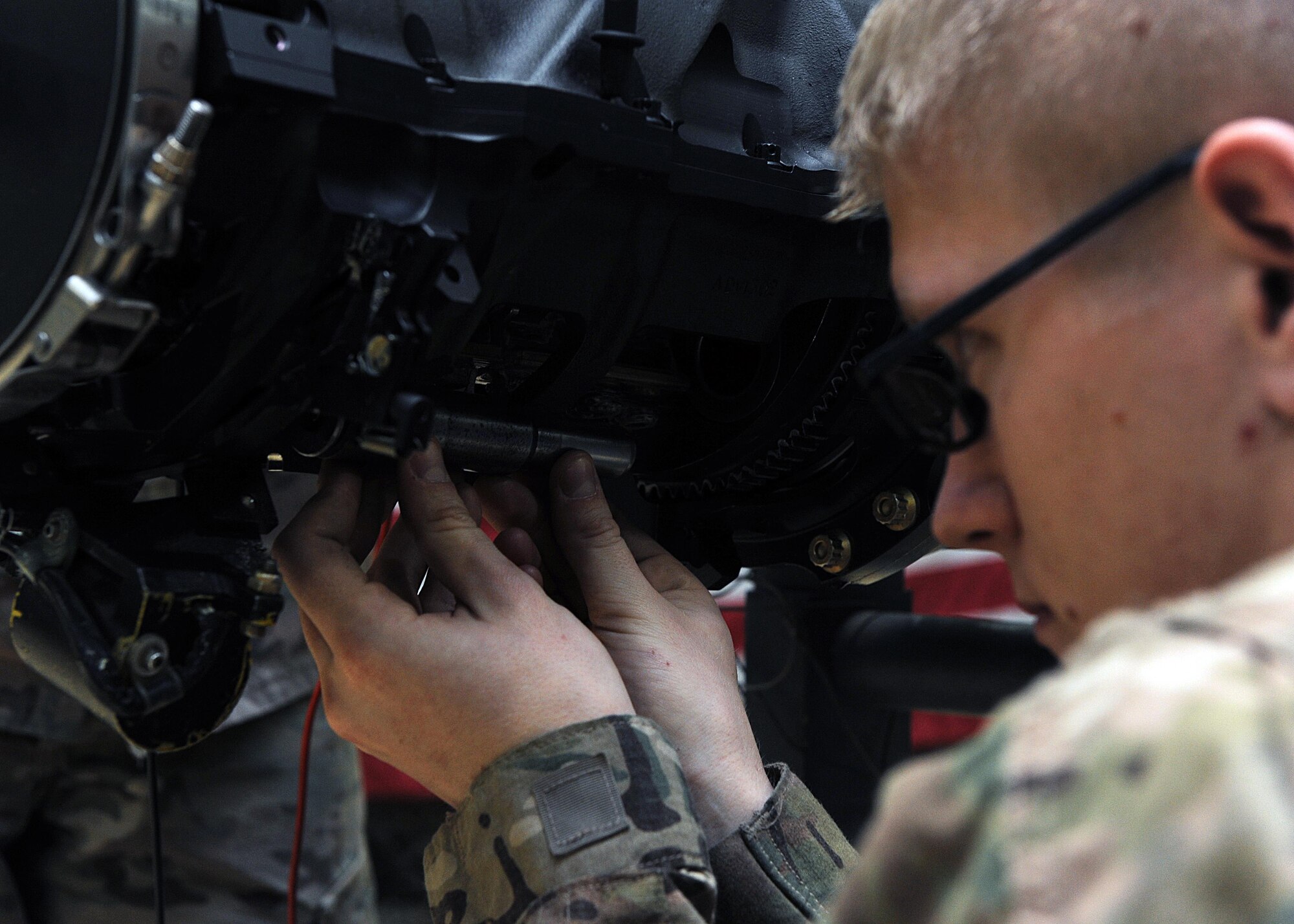 U.S. Air Force Staff Sgt. Damion Arendtsen, 455th Expeditionary Maintenance Squadron Armament technician, performs an electrical and maintenance check on an F-16 Fighting Falcon gun system March 12, 2015 at Bagram Airfield, Afghanistan. Airmen assigned to the Armament shop are charged with the responsibility of ensuring weapons systems are standing by to support counterterrorism operations in Afghanistan. (U.S. Air Force photo by Staff Sgt. Whitney Amstutz/released)