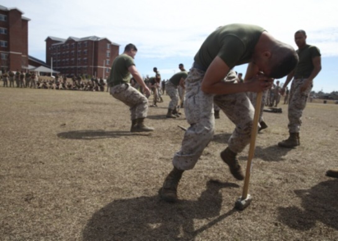Marine Corps engineers compete in a “Dizzy Izzy” relay competition during the annual St. Patrick’s Day Engineer Field Meet, March 12, 2015, on Ellis Field at Courthouse Bay aboard Marine Corps Base Camp Lejeune, N.C. Engineers from across Camp Lejeune and New River Air Station came together to compete in 15 engineer-themed events in honor of the patron saint of engineers, St. Patrick. (U.S. Marine Corps photo by Cpl Michelle Reif/released)