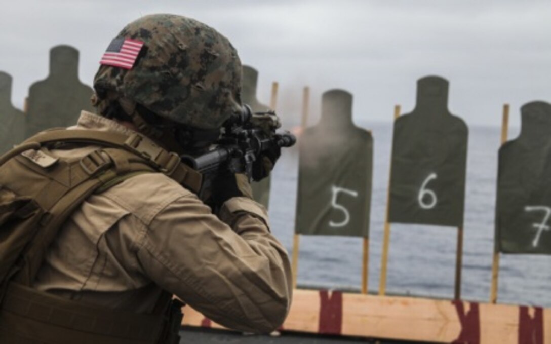 Sgt. Justin Leduc conducts marksmanship training on the flight deck of the USS Essex during Amphibious Squadron/Marine Expeditionary Unit Integration Training off the coast of San Diego Feb. 27, 2015. 