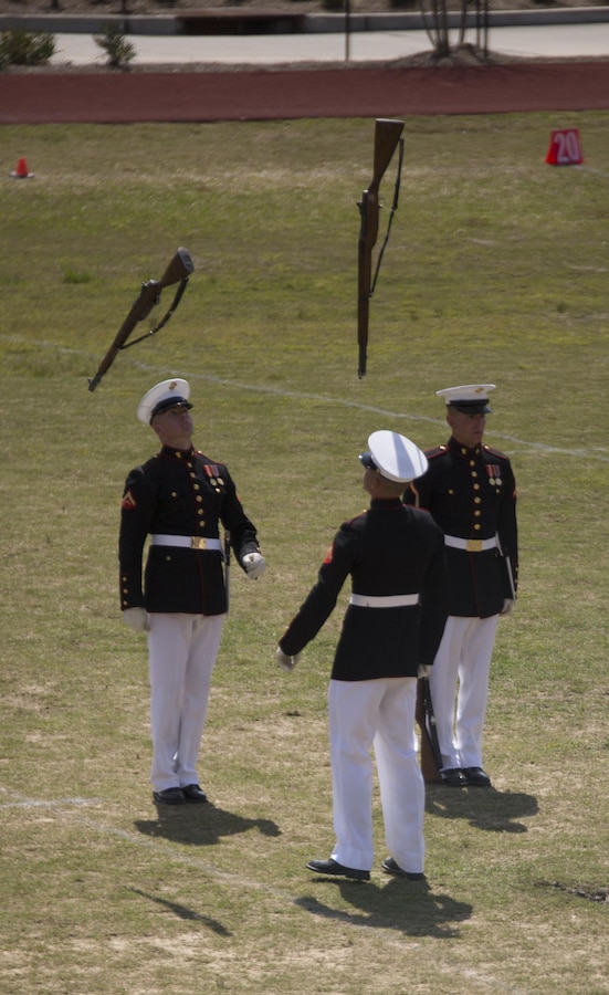 Marines from the Marine Corps Silent Drill Platoon execute a drill movement during a Battle Colors Ceremony at Marine Corps Support Facility New Orleans, March 17, 2015. The platoon and the Marine Drum and Bugle Corps perform at events across the country, showing spectators the discipline, precision and professionalism all Marines embody.