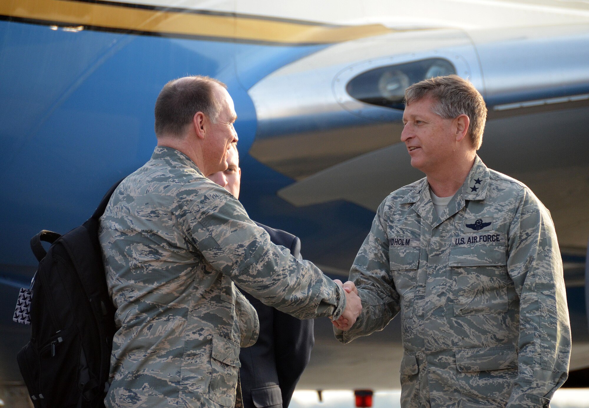 Maj. Gen. Derek Rydholm, Director of Plans, Programs and Requirements, Headquarters Air Force Reserve Command, greets Air Mobility Command staff members as they deplane at Robins Air Force Base, Georgia, March 18. Representatives from the Air National Guard are also present for the Air Reserve Component Focus Day Conference as it serves as a discussion forum for senior leaders for topics revolving around Total Force integration. (U.S. Air Force photo/Staff Sgt. Kelly Goonan)