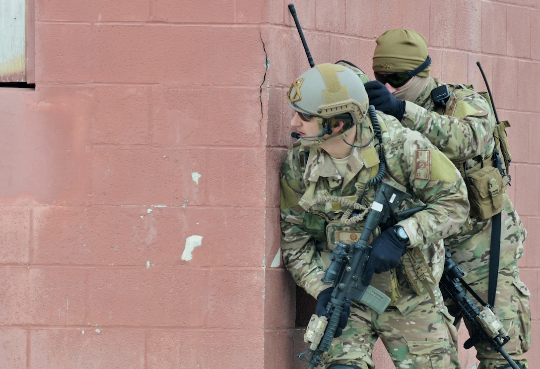 Senior Airman Michael Sorensen (left) and Staff Sgt. George Stratakos establish a perimeter during an exercise March 14, 2015, at Fort Drum, N.Y. Thirty Airmen from the New York Air National Guard’s 274th Air Support Operations Squadron (ASOS) participated in close air support (CAS) training that enhanced their ability to identify a target and neutralize a threat. The 274th mission is to advise U.S. Army commanders on how to best utilize U.S. and NATO assets for CAS. (New York Air National Guard photo/Master Sgt. Eric Miller)