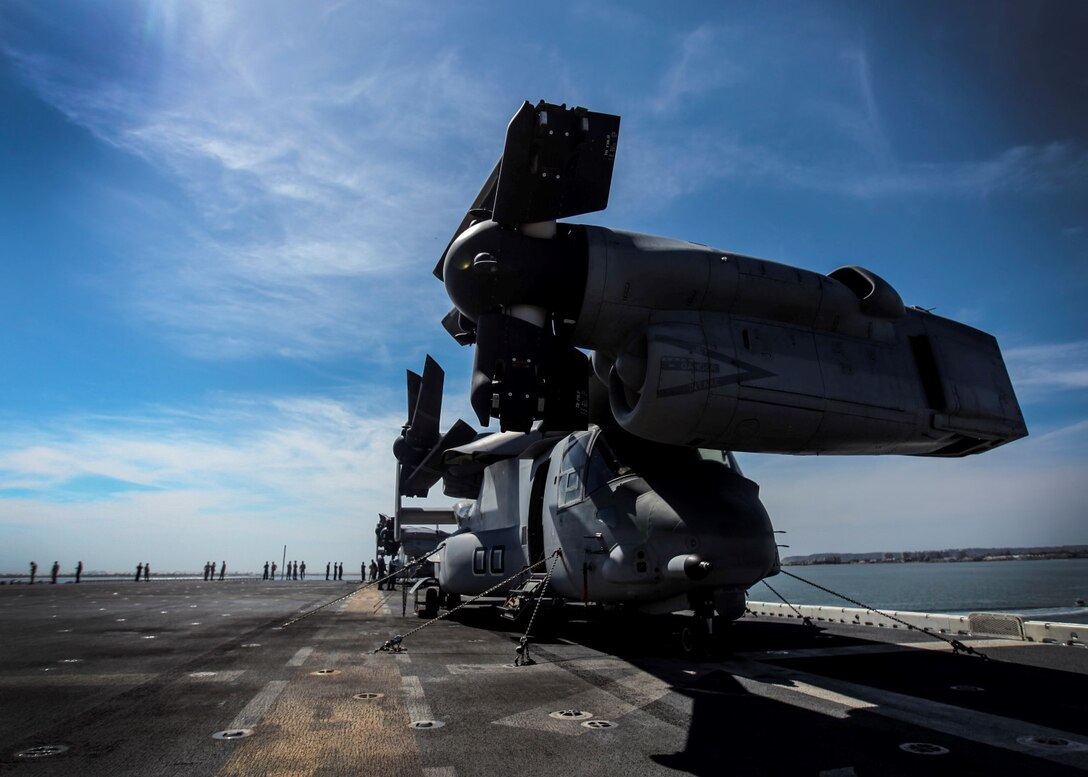 U.S. Marines and Sailors enjoy some sun as they prepare to leave port on the USS Essex (LHD 2) during Composite Training Unit Exercise (COMPTUEX) aboard Naval Base San Diego March 16, 2015. The 15th MEU is embarked aboard the three ships of the Essex Amphibious Ready Group - the USS Essex, USS Anchorage (LPD 23), and USS Rushmore (LSD 47) – during COMPTUEX to continue integrating and training with the PHIBRON and ship staffs as they prepare for deployment later this spring. (U.S. Marine Corps photo by Cpl. Elize McKelvey/Released)