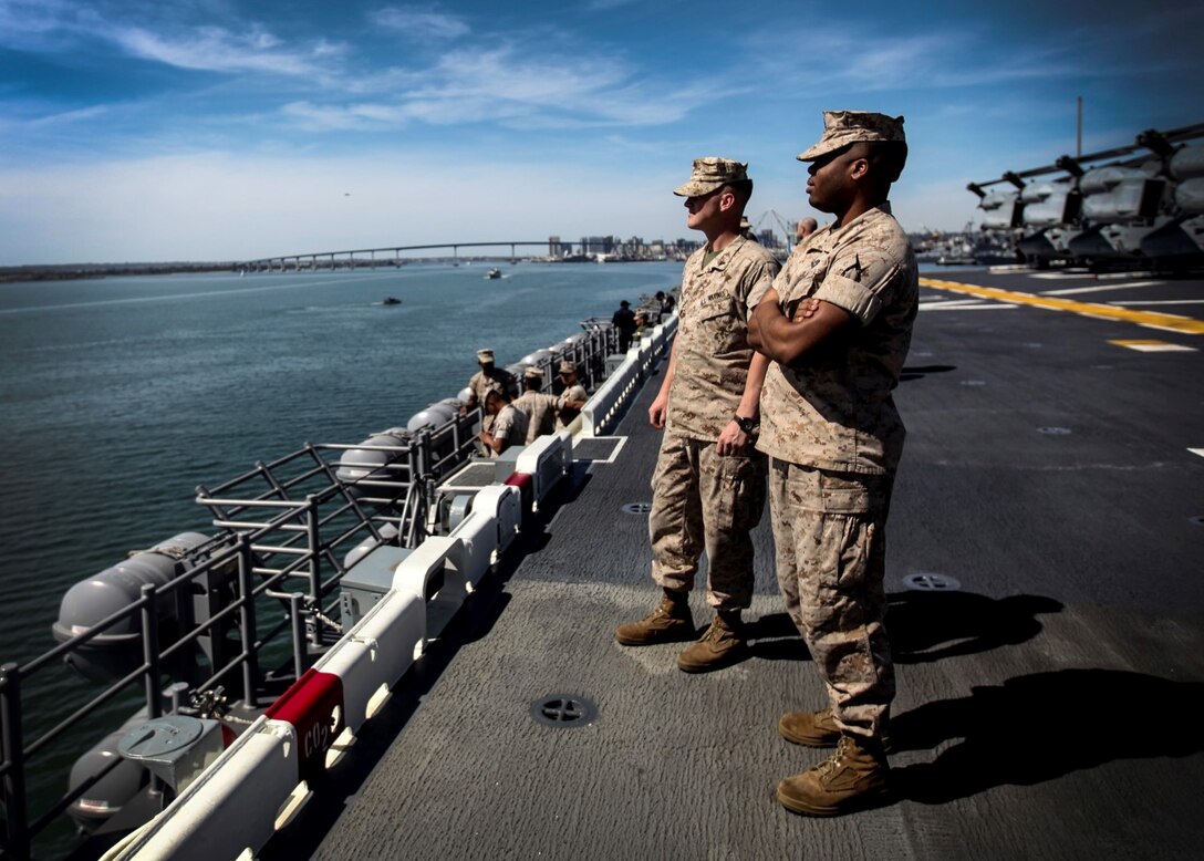 U.S. Marines and Sailors enjoy the view as they leave port on the USS Essex (LHD 2) during Composite Training Unit Exercise (COMPTUEX) aboard Naval Base San Diego March 16, 2015. The 15th MEU is embarked aboard the three ships of the Essex Amphibious Ready Group – the USS Essex, USS Anchorage (LPD 23), and USS Rushmore (LSD 47) – during COMPTUEX to continue integrating and training with the PHIBRON and ship staffs as they prepare for deployment later this spring. (U.S. Marine Corps photo by Cpl. Elize McKelvey/Released)