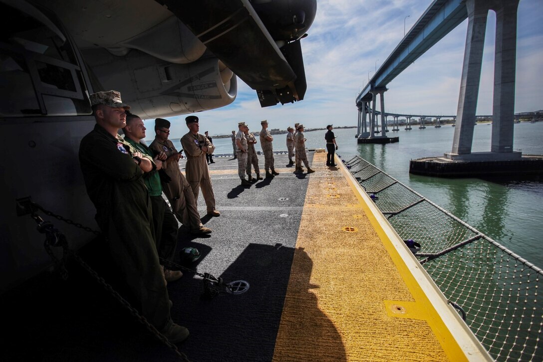 U.S. Marines and Sailors enjoy the view as they leave port on the USS Essex (LHD 2) during Composite Training Unit Exercise (COMPTUEX) aboard Naval Base San Diego March 16, 2015. The 15th MEU is embarked aboard the three ships of the Essex Amphibious Ready Group - the USS Essex, USS Anchorage (LPD 23), and USS Rushmore (LSD 47) – during COMPTUEX to continue integrating and training with the PHIBRON and ship staffs as they prepare for deployment later this spring. (U.S. Marine Corps photo by Cpl. Elize McKelvey/Released)