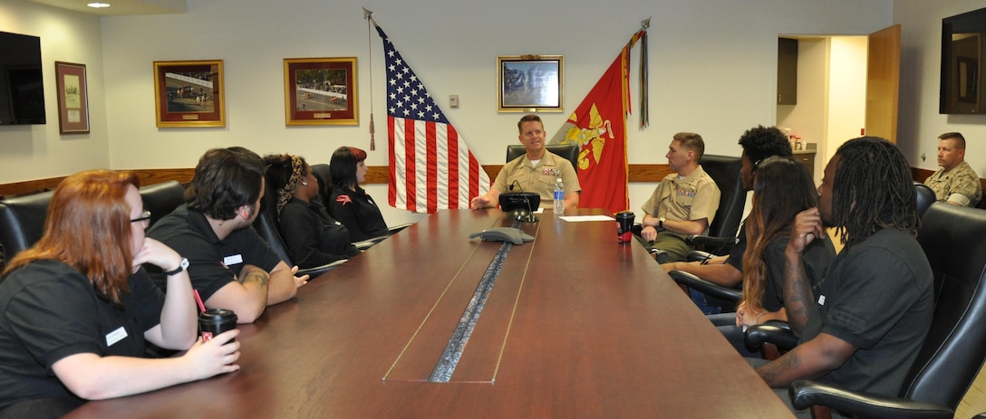 Lt. Col. Thomas P. Favor, executive officer of Marine Corps Logistics Base Barstow, Capt. Stafford A. Buchanan, deputy operations officer, and Sgt. Maj. Karl D. Simburger, base sergeant major, engage students from Barstow Community College's Career Institute Leadership Connection program in an interactive question and answer session during a tour of MCLB Barstow, Calif., March 13.  The program develops young leaders in the local community and helps establish meaningful business networking opportunities with organizations.