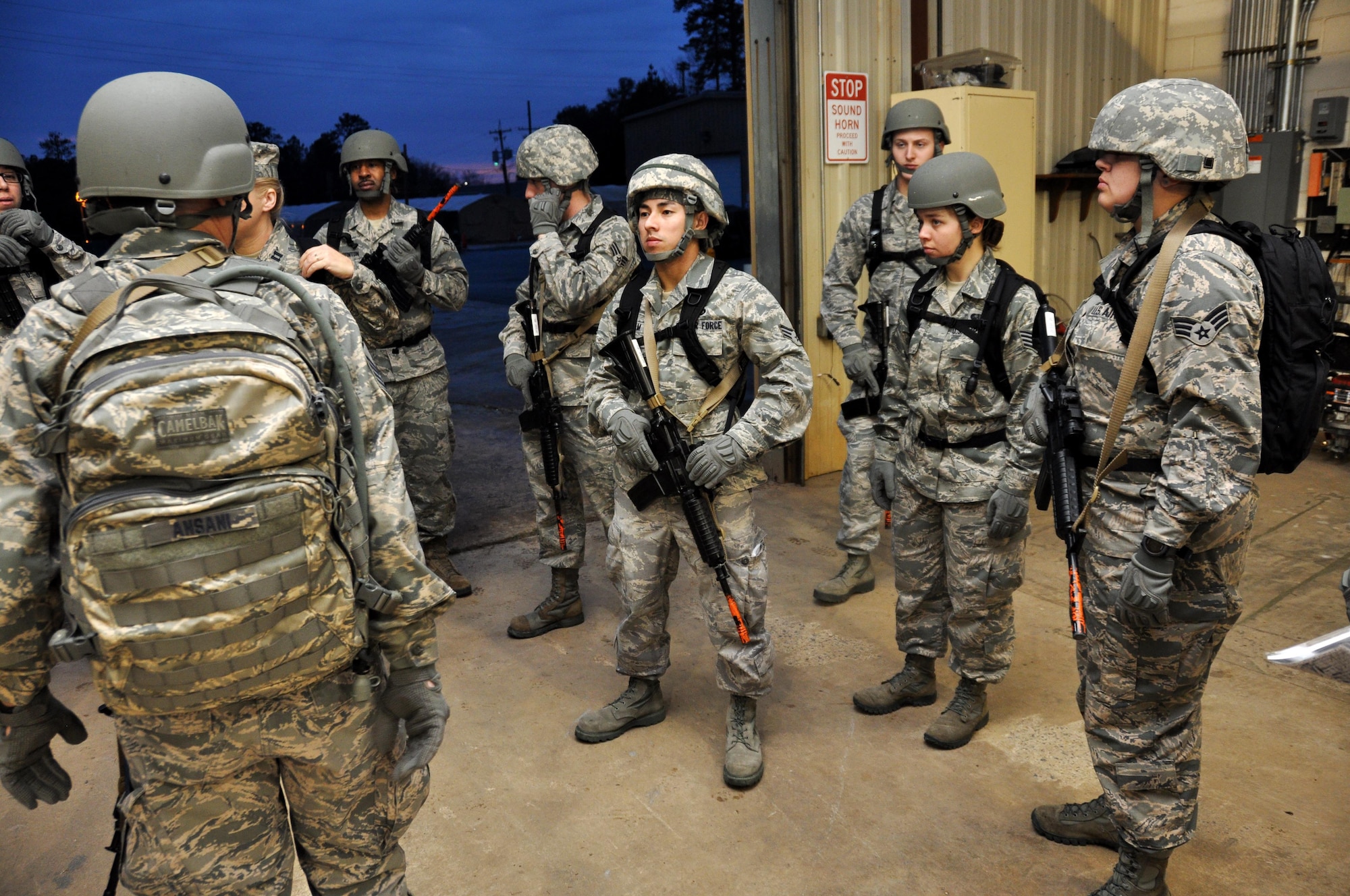 Airmen from the 911th Force Support Squadron, Pittsburgh, Pa., gear up for a patrol for OPERATION Everybody Panic as part of Force Support Silver Flag at Dobbins Air Reserve Base, Ga., March 10, 2015. Teams were tasked with engaging targets, self-aid buddy care, providing care under fire, identifying unexploded ordnances and improvised explosive devices, describing and providing the location of the UXOs and IEDs on a grid, low and high crawling, and transporting remains during this scenario. (U.S. Air Force photo/Senior Airman Daniel Phelps)