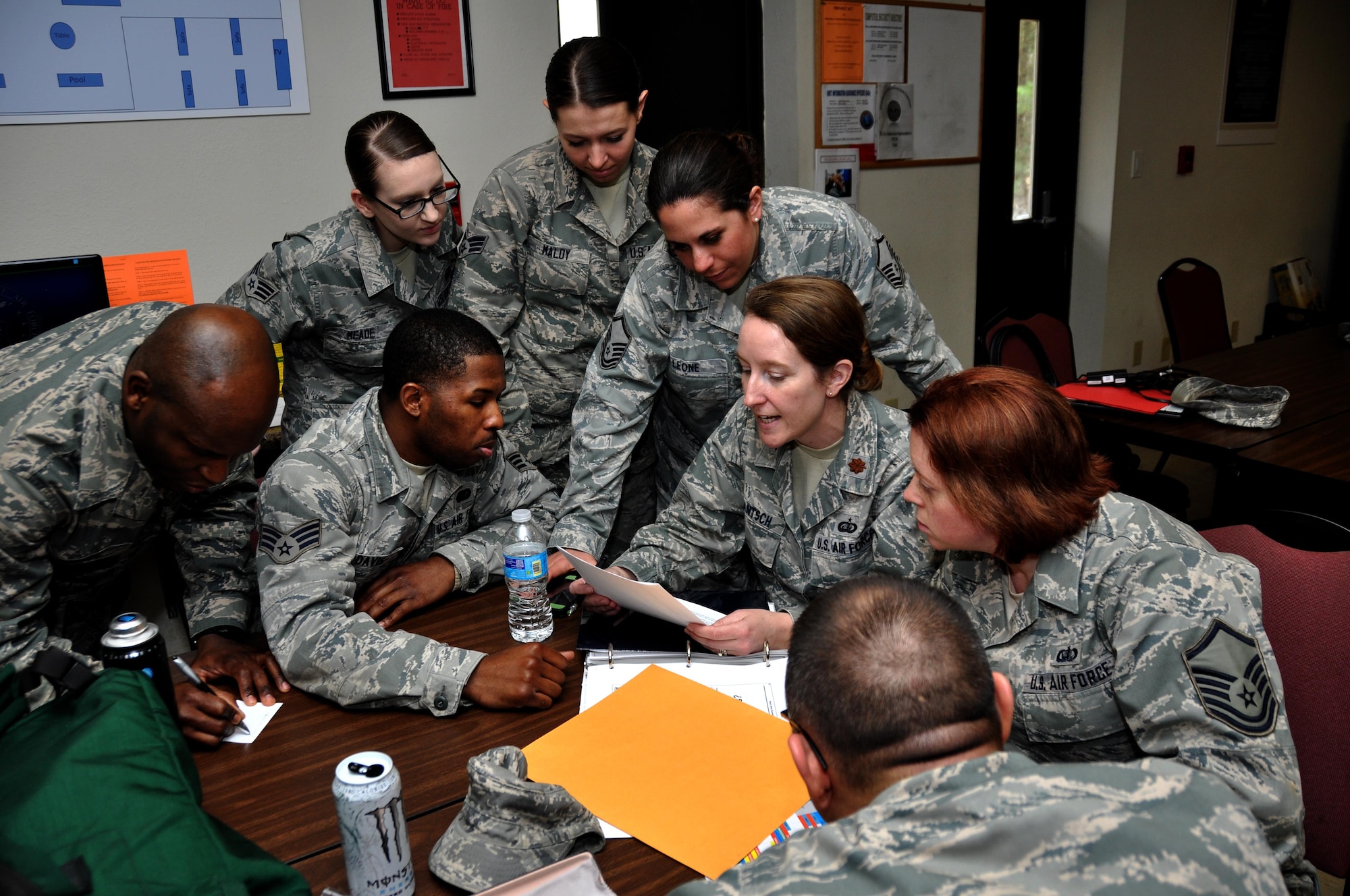 Airmen from the 910th Force Support Squadron from Youngstown Air Reserve Base, Ohio, go over plans to build a bare base from scratch during a table top deployment scenario for Force Support Silver Flag at Dobbins Air Reserve Base, Ga., March 10, 2015. About 70 Airmen on teams from Peterson Air Force Base, Colorado; the 445th FSS from Wright-Patterson Air Force Base, Ohio; the 908th FSS from Maxwell AFB, Alabama; the 910th FSS from Youngstown ARB, Ohio; the 911th FSS from Pittsburgh, Pennsylvania; and the 934th FSS from Minneapolis – St. Paul, Minnesota competed in FS Silver Flag. (U.S. Air Force photo/Senior Airman Daniel Phelps)