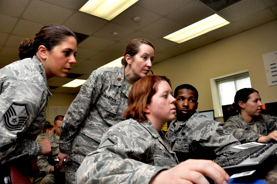 Airmen from the 910th Force Support Squadron from Youngstown Air Reserve Base, Ohio, go over plans to build a bare base from scratch during a table top deployment scenario for Force Support Silver Flag at Dobbins Air Reserve Base, Ga., March 10, 2015. About 70 Airmen on teams from Peterson Air Force Base, Colorado; the 445th FSS from Wright-Patterson Air Force Base, Ohio; the 908th FSS from Maxwell AFB, Alabama; the 910th FSS from Youngstown ARB, Ohio; the 911th FSS from Pittsburgh, Pennsylvania; and the 934th FSS from Minneapolis – St. Paul, Minnesota competed in FS Silver Flag. (U.S. Air Force photo/Senior Airman Daniel Phelps)