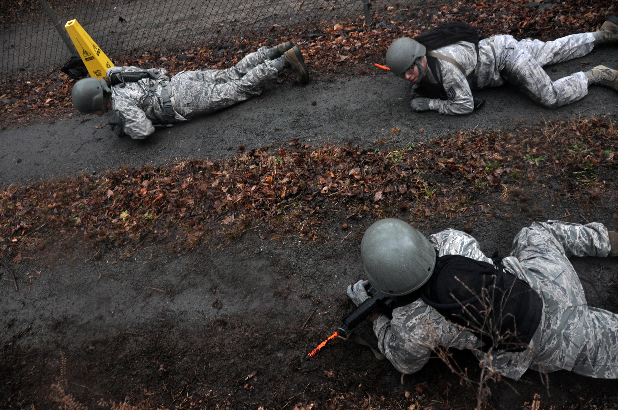 Airmen from the 911th Force Support Squadron, Pittsburgh, Pa., low crawl to avoid being detected during OPERATION Everybody Panic as part of Force Support Silver Flag at Dobbins Air Reserve Base, Ga., March 10, 2015. The challenge consisted of teams competing against each other in nine different events ranging from following a convoy, building tents, fixing Babington burners, cooking meals, planning lodging, planning a base from scratch, driving a forklift and a scavenger hunt. (U.S. Air Force photo/Senior Airman Daniel Phelps)