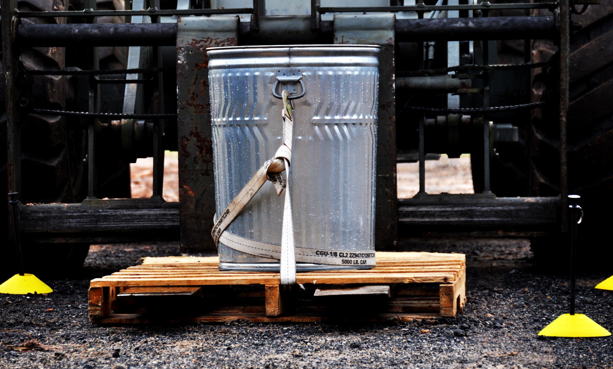 A forklift attempts to lower a trash can full of without spilling any water during Force Support Silver Flag at Dobbins Air Reserve Base, Georgia, March 11, 2015. About 70 Airmen on teams from Peterson Air Force Base, Colorado; the 445th FSS from Wright-Patterson Air Force Base, Ohio; the 908th FSS from Maxwell AFB, Alabama; the 910th FSS from Youngstown ARB, Ohio; the 911th FSS from Pittsburgh, Pennsylvania; and the 934th FSS from Minneapolis – St. Paul, Minnesota competed in FS Silver Flag.  (U.S. Air Force photo/Senior Airman Daniel Phelps)