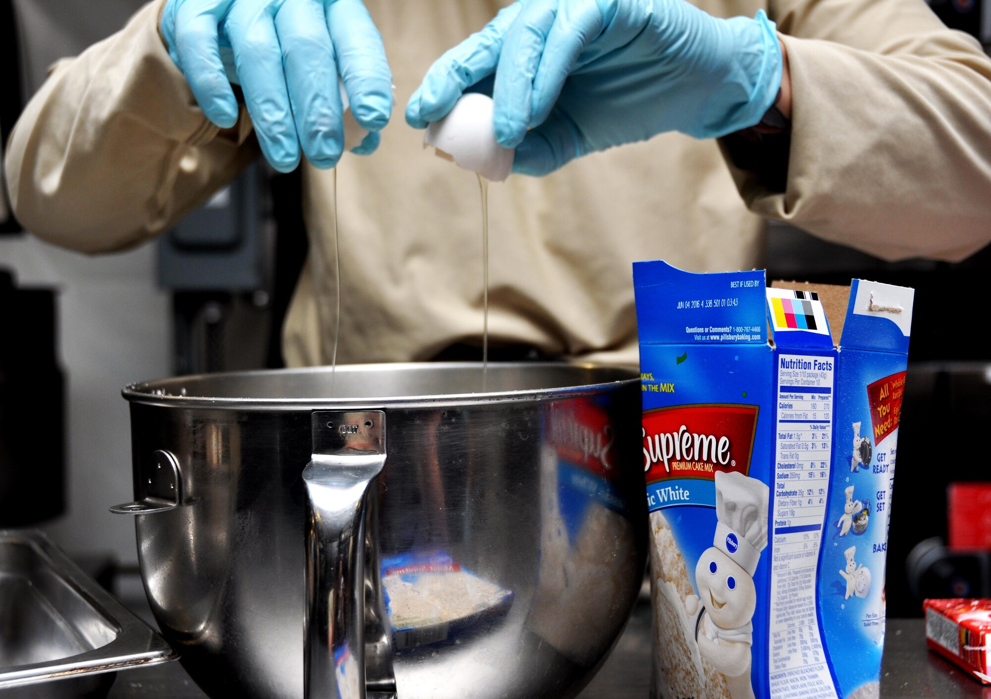Master Sgt. Nikole Zottola, 911th Force Support Squadron, Pittsburgh, Pa., cracks eggs to make batter for a cake for dessert during the Readiness Challenge for Force Support Silver Flag at Dobbins Air Reserve Base, Georgia, March 11, 2015. About 70 Airmen on teams from Peterson Air Force Base, Colorado; the 445th FSS from Wright-Patterson Air Force Base, Ohio; the 908th FSS from Maxwell AFB, Alabama; the 910th FSS from Youngstown ARB, Ohio; the 911th FSS from Pittsburgh, Pennsylvania; and the 934th FSS from Minneapolis – St. Paul, Minnesota competed in FS Silver Flag. (U.S. Air Force photo/Senior Airman Daniel Phelps)