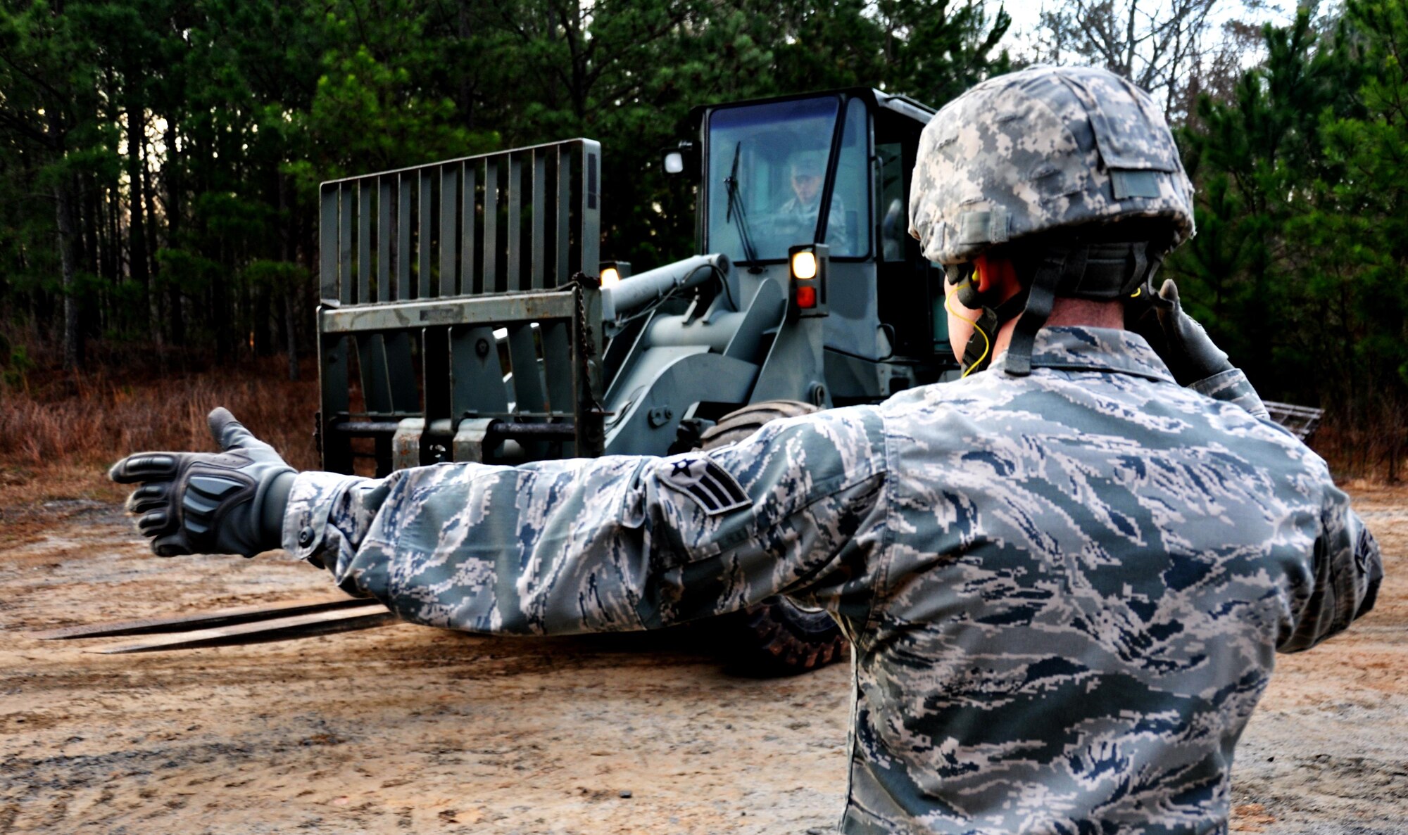 Senior Airmen Tyler Wright, 911th Force Support Squadron, Pittsburgh, Pa., guides a forklift during the Readiness Challenge for Force Support Silver Flag at Dobbins Air Reserve Base, Georgia, March 11, 2015. About 70 Airmen on teams from Peterson Air Force Base, Colorado; the 445th FSS from Wright-Patterson Air Force Base, Ohio; the 908th FSS from Maxwell AFB, Alabama; the 910th FSS from Youngstown ARB, Ohio; the 911th FSS from Pittsburgh, Pennsylvania; and the 934th FSS from Minneapolis – St. Paul, Minnesota competed in FS Silver Flag. (U.S. Air Force photo/Senior Airman Daniel Phelps)
