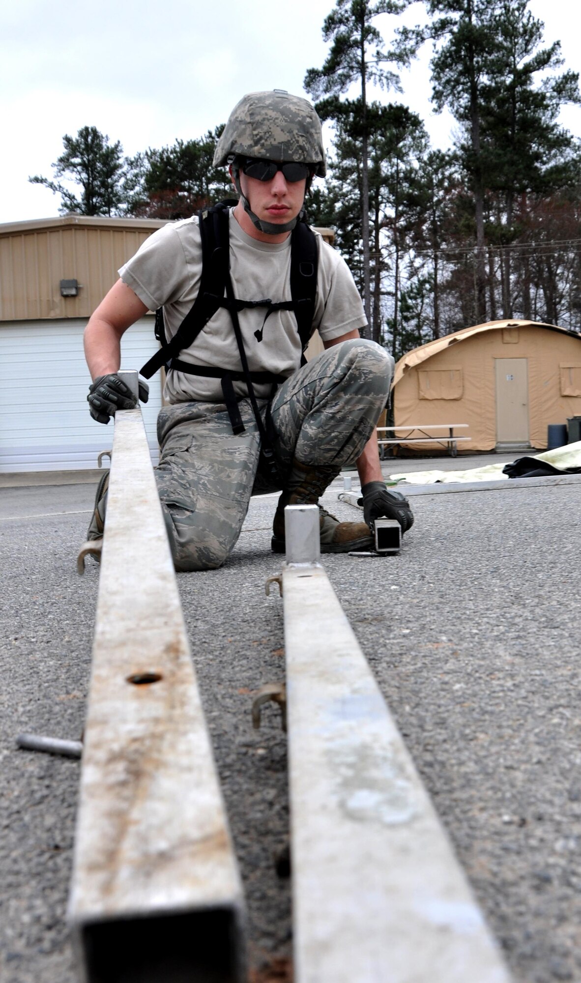 Staff Sgt. Daniel Chrest and Master Sgt. Mark Ansani, 911th Force Support Squadron, Pittsburgh, Pa., plot out their route on a map during OPERATION Everybody Panic as part of Force Support Silver Flag at Dobbins Air Reserve Base, Ga., March 10, 2015. Teams were tasked with engaging targets, self-aid buddy care, providing care under fire, identifying unexploded ordnances and improvised explosive devices, describing and providing the location of the UXOs and IEDs on a grid, low and high crawling, and transporting remains during this scenario.  (U.S. Air Force photo/Senior Airman Daniel Phelps)