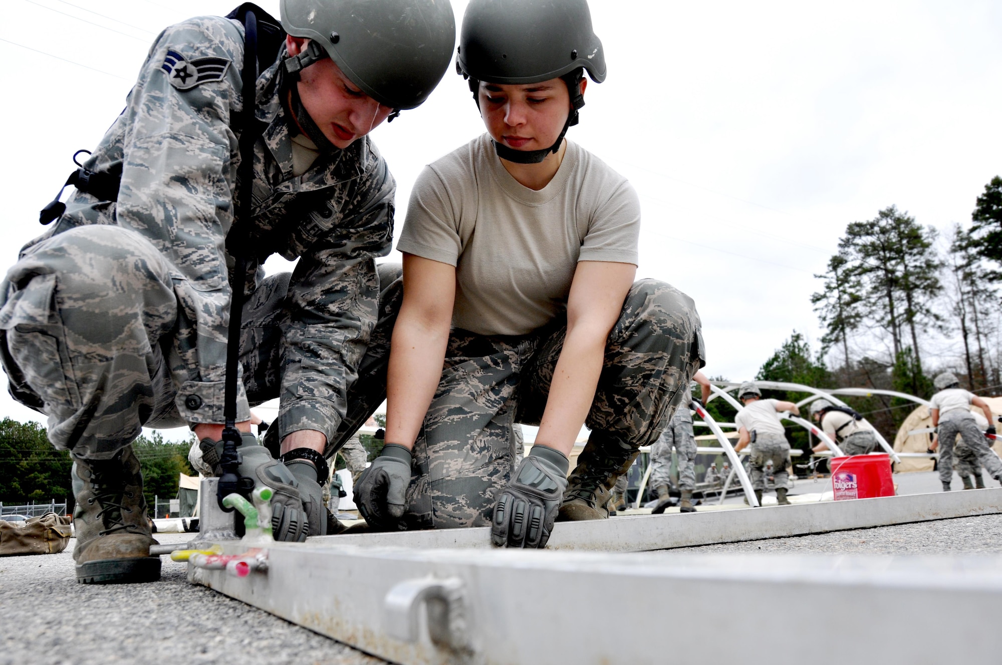 Senior Airmen Dominic Maggs and Staff Sgt. Kelsey Ansen, both 911th Force Support Squadron, Pittsburgh, Pa., place pipes to build a tent during the Readiness Challenge for Force Support Silver Flag at Dobbins Air Reserve Base, Georgia, March 12, 2015. About 70 Airmen on teams from Peterson Air Force Base, Colorado; the 445th FSS from Wright-Patterson Air Force Base, Ohio; the 908th FSS from Maxwell AFB, Alabama; the 910th FSS from Youngstown ARB, Ohio; the 911th FSS from Pittsburgh, Pennsylvania; and the 934th FSS from Minneapolis – St. Paul, Minnesota competed in FS Silver Flag. (U.S. Air Force photo/Senior Airman Daniel Phelps)