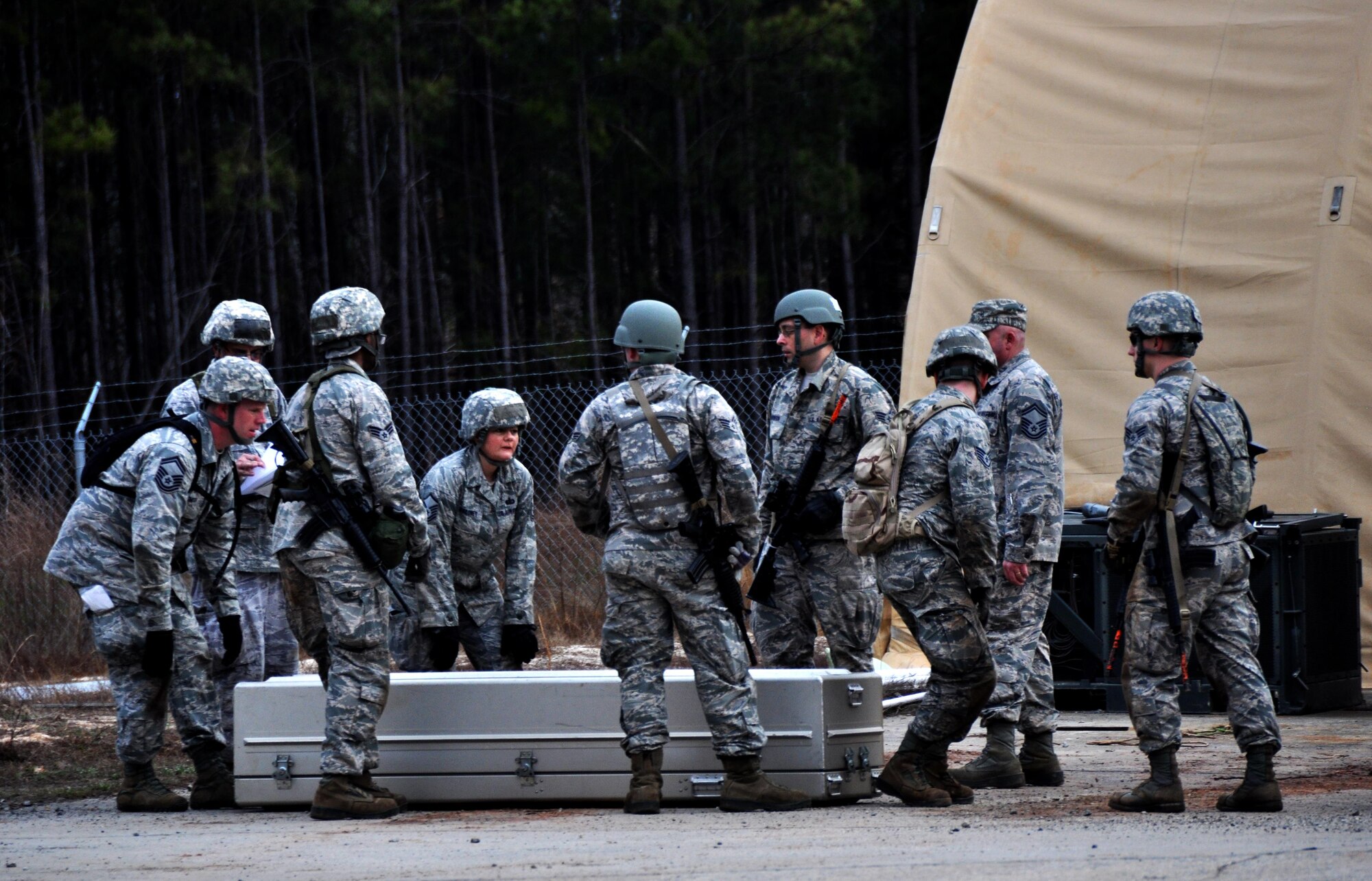 Participants in Force Support Silver Flag lower a coffin during the Readiness Challenge at Dobbins Air Reserve Base, Georgia, March 12, 2015. The challenge consisted of teams competing against each other in nine different events ranging from following a convoy, building tents, fixing Babington burners, cooking meals, planning lodging, planning a base from scratch, driving a forklift and a scavenger hunt.  (U.S. Air Force photo/Senior Airman Daniel Phelps)