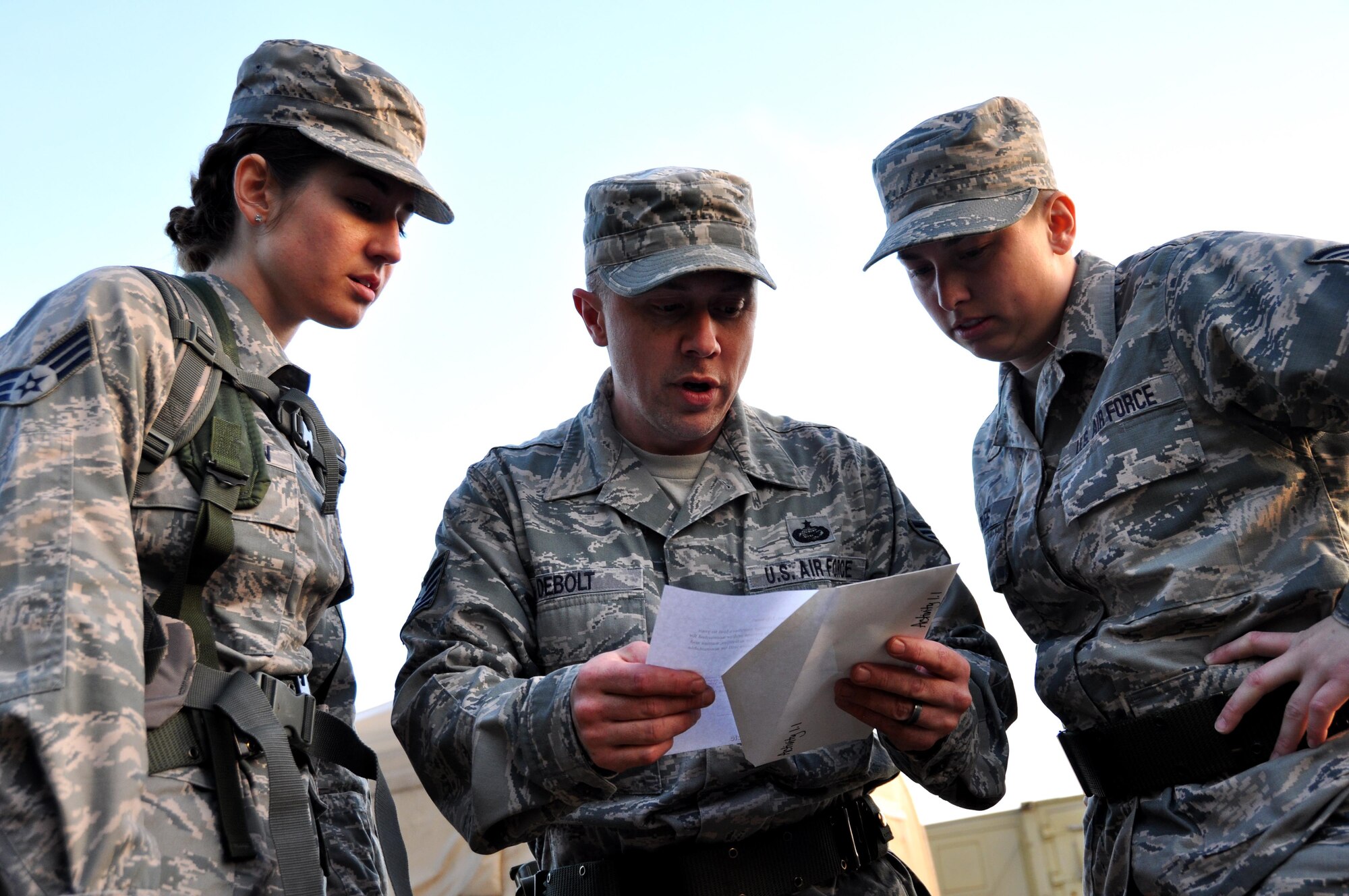 Senior Airman Jessica McMillan, Tech. Sgt. Harold Debolt and Staff Sgt. Alison Barnes, all from the 445th Force Support Squadron at Wright Patterson Air Force Base, Ohio, review a clue for the scavenger hunt portion of the Readiness Challenge for Force Support Silver Flag at Dobbins Air Reserve Base, Georgia, March 12, 2015. Silver Flag participants had to race through numerous obstacles and puzzles during the portion on the challenge.  (U.S. Air Force photo/Senior Airman Daniel Phelps)