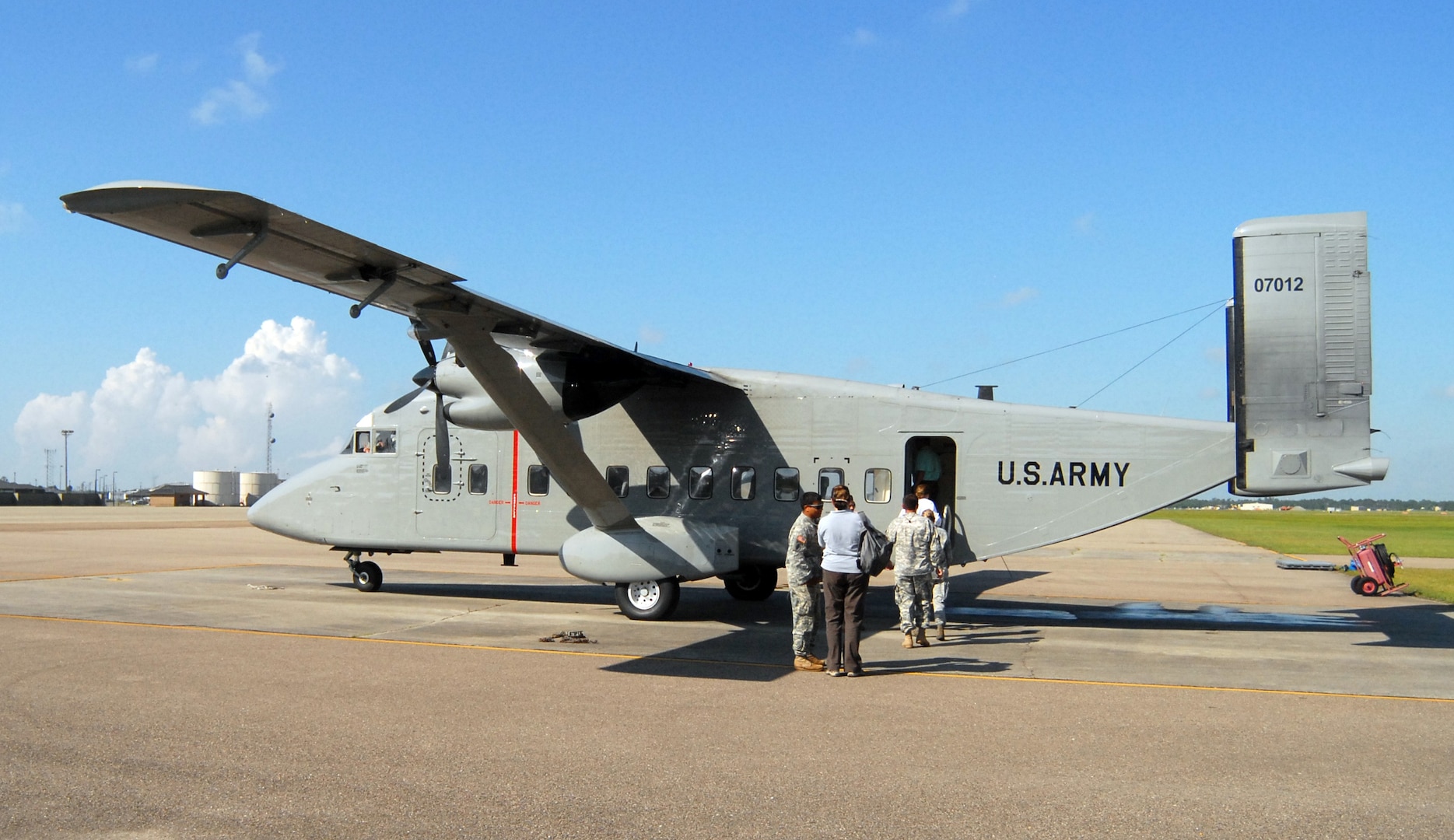 Passengers board C-23B Sherpa, affectionately known as the "flying Winnebago" to its crew before a recent flight.