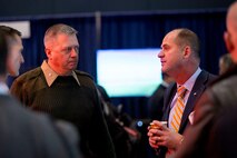LtCol Patrick Kirchner, with the Futures Directorate's Futures Assessment Division, listens as a visitor to the Naval Future Force Expo explains a potential solution to one of the Navy and Marine Corps' S&T challenges.