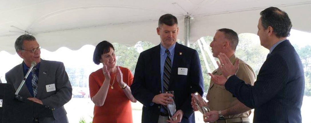 Marine Corps Logistics Base Albany and Marine Corps Logistics Command officials attend a celebratory luncheon March 18 for the new Albany Green Energy biomass plant along with other community leaders. The new Biomass Plant will use waste wood to provide steam to help run one of Procter & Gamble's largest U.S. facilities and provide renewable electricity for the residents of Georgia. It will include a proposed partnership with MCLB Albany, which will use an Energy Savings Performance Contract to construct and operate a steam-to-electric generator on P&G's property.