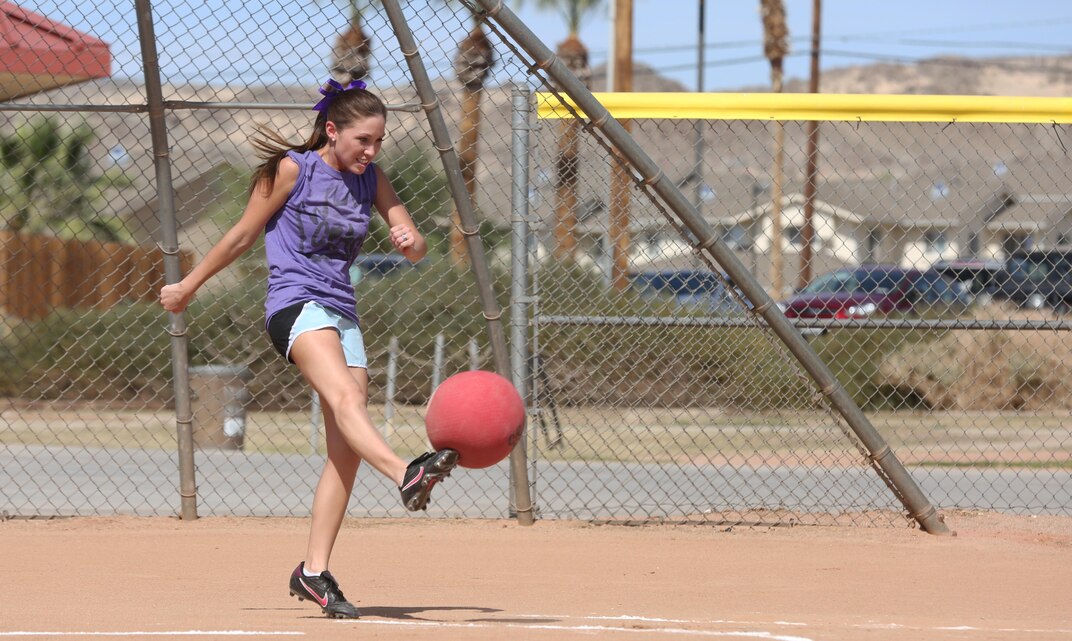 Jessica Kick, in-fielder, the Crash, kicks the ball during a spouses’ kickball game at Felix Field, March 15, 2015. The league currently has more than 70 spouses participating who are divided into five teams. (Official Marine Corps photo by Pfc. Levi Schultz/Released)