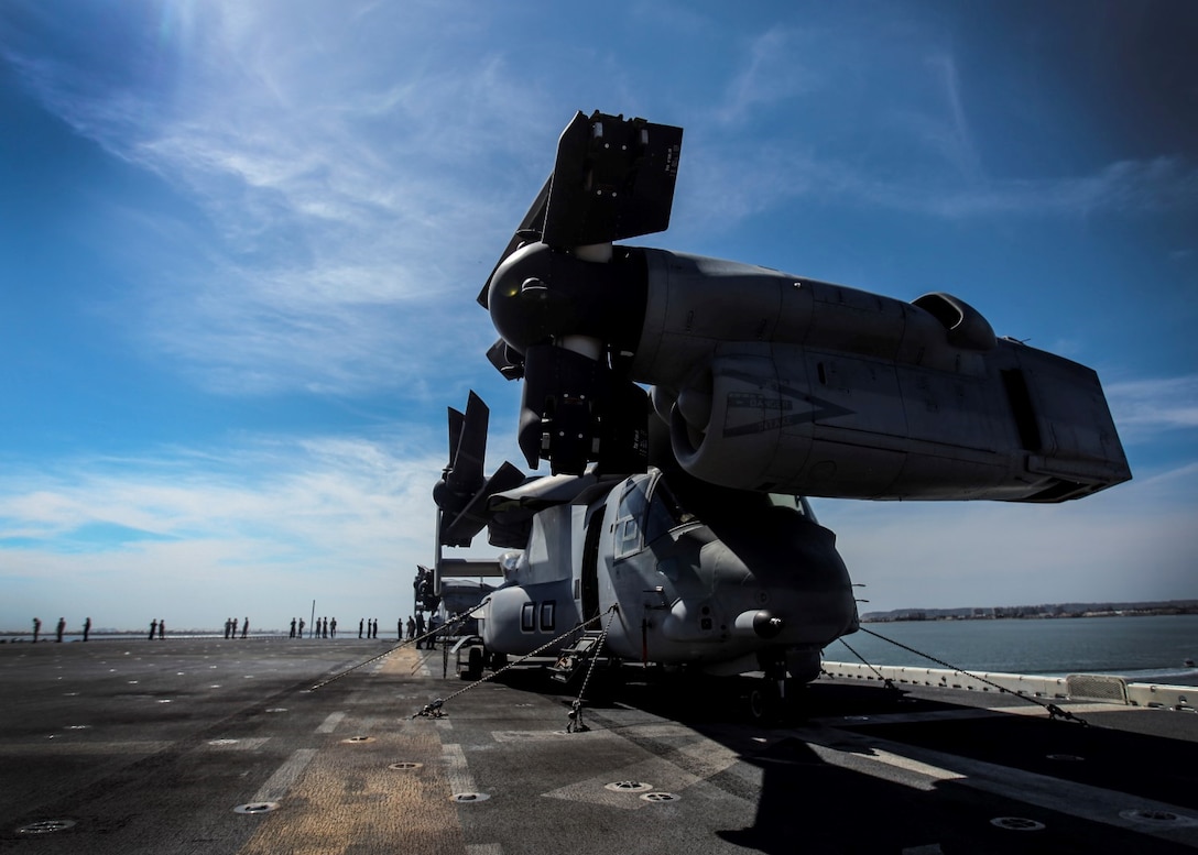 U.S. Marines and Sailors enjoy some sun as they prepare to leave port on the USS Essex (LHD 2) during Composite Training Unit Exercise (COMPTUEX) aboard Naval Base San Diego March 16, 2015. The 15th MEU is embarked aboard the three ships of the Essex Amphibious Ready Group - the USS Essex, USS Anchorage (LPD 23), and USS Rushmore (LSD 47) – during COMPTUEX to continue integrating and training with the PHIBRON and ship staffs as they prepare for deployment later this spring. (U.S. Marine Corps photo by Cpl. Elize McKelvey/Released)