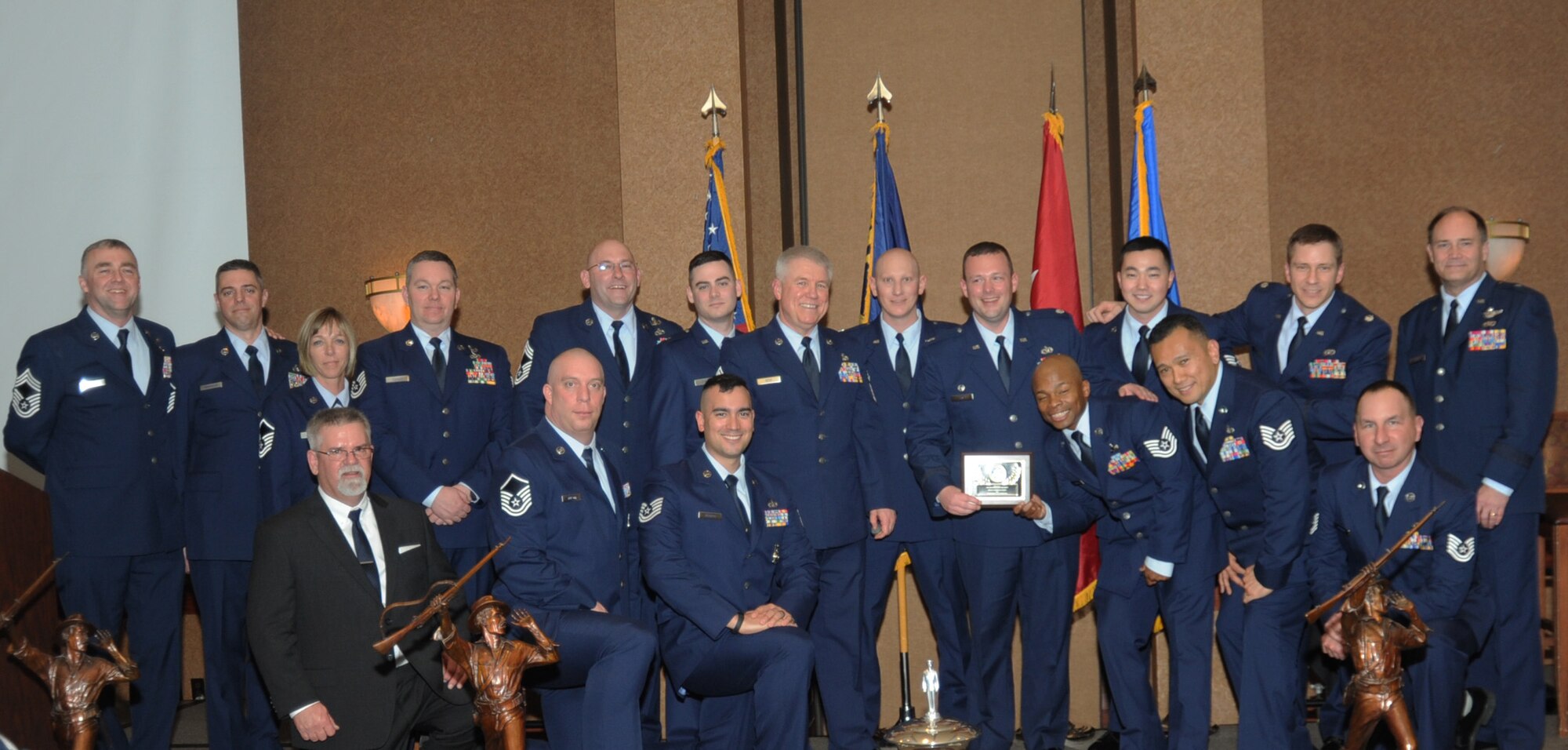 Members of the 142nd Civil Engineer Squadron, 142nd Fighter Wing, gather for a group photograph with Air Component Commander Brig. Gen. Michael Stencel, far right, during the 21st Annual Oregon Air National Guard Awards Banquet, March 14, 2015, Portland, Ore. The 142nd CES was awarded the Oregon Air National Guard’s Outstanding Unit of the Year Award for 2014.