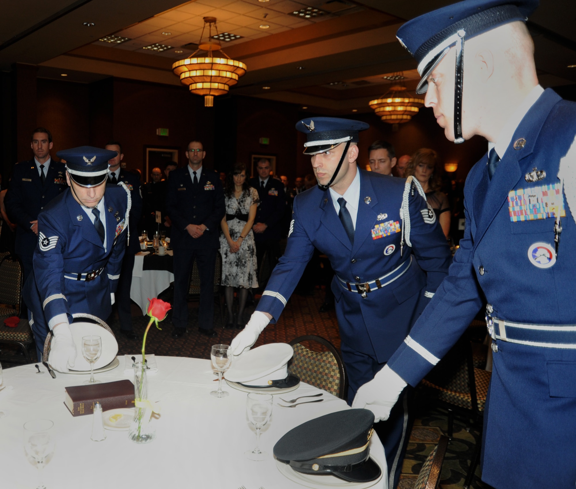 Members of the 142nd Fighter Wing Base Honor Guard, Portland Air National Guard Base, Ore., perform a MIA-POW Hat Ceremony during the 21st Annual Oregon Air National Guard Awards Banquet, March 14, 2015, Portland. (U.S. Air National Guard photo by Tech. Sgt. Emily Thompson, 142nd Fighter Wing Public Affairs/Released)